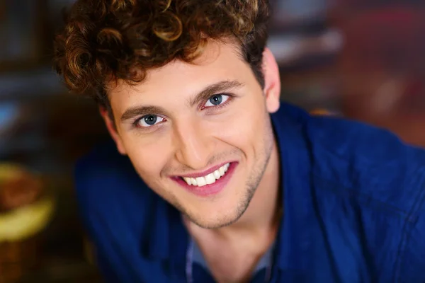 Handsome man with curly hair — Stock Photo, Image
