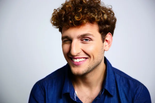 Handsome man with curly hair — Stock Photo, Image