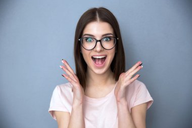 Surprised young woman in glasses clipart