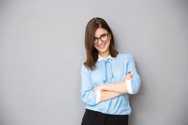 Portrait of a happy businesswoman with arms folded — Stock Photo, Image