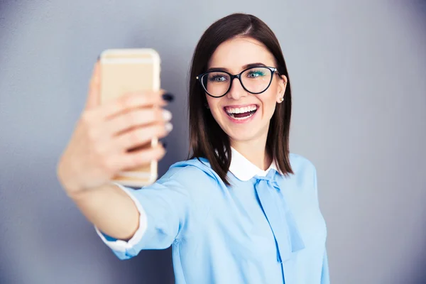 Laughing businesswoman making selfie photo — Stock Photo, Image