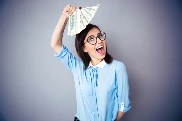 Happy businesswoman holding bill of dollars — Stock Photo, Image