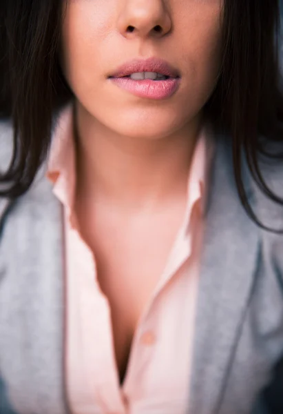 Woman bitting her lips — Stock Photo, Image