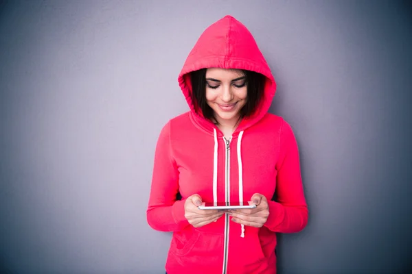 Beautiful cute woman using smartphone — Stock Photo, Image