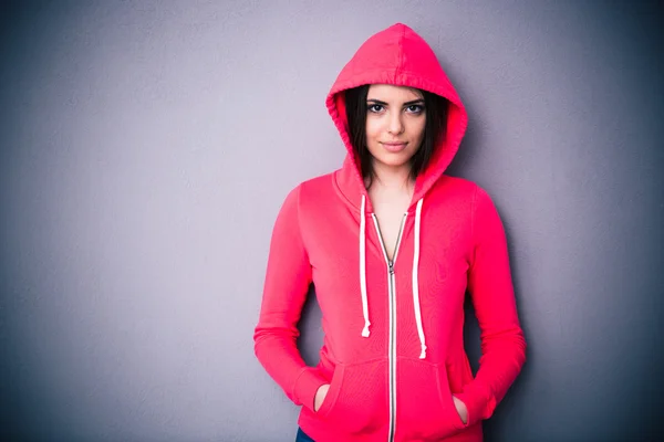 Beautiful woman in red jacket with hood — Stock Photo, Image