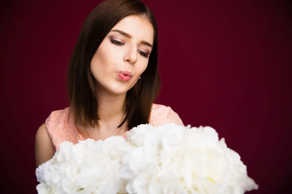 Portrait of a young woman with flowers — Stock Photo, Image