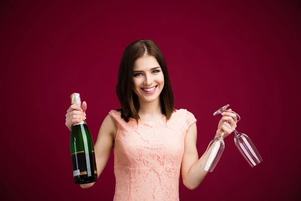 Happy woman holding two glass and bottle of champagne — Stock Photo, Image