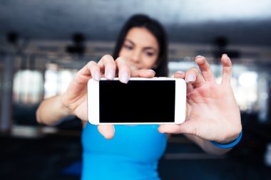 Woman making selfie photo on smartphone clipart