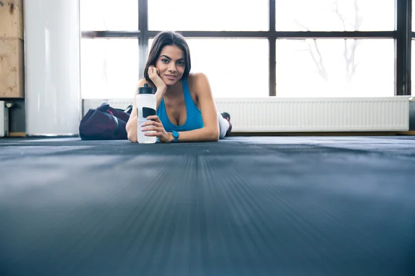 Sports young woman lying on the floor — Stock Photo, Image