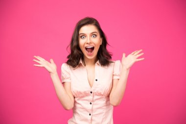 Surprised woman shouting over pink background clipart