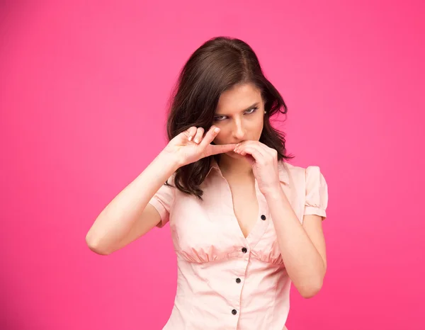 Young woman biting her nails — Stock Photo, Image