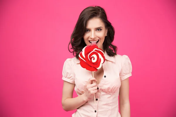 Happy woman holding lollipop — Stock Photo, Image