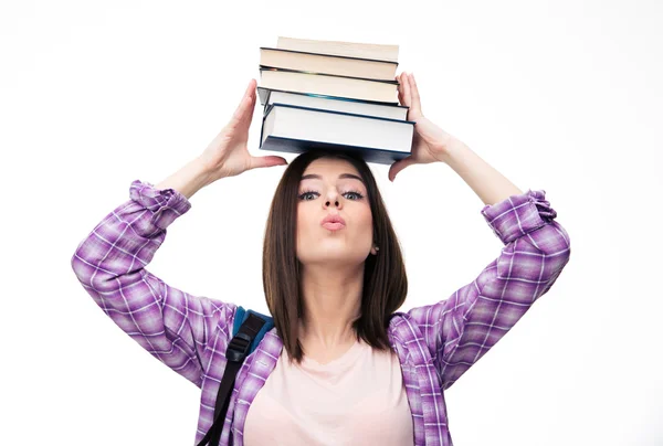 Joven wowan sosteniendo libros en la cabeza — Foto de Stock