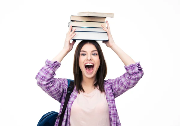 Ridendo giovane wowan con libri sulla testa — Foto Stock
