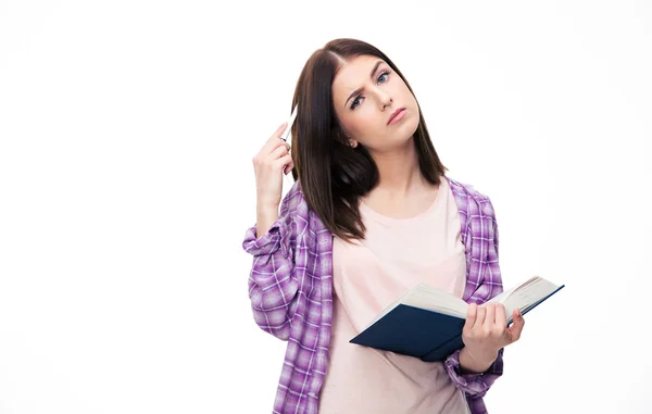 Pensive young female student standing with book — Stock Photo, Image