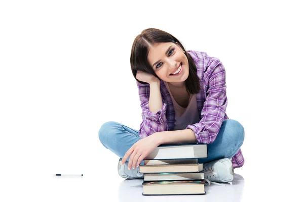 Mujer feliz sentada en el suelo con libros — Foto de Stock