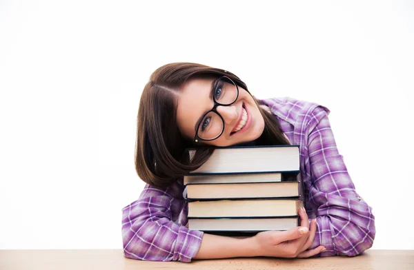 Vrouwelijke student zitten aan de tafel met boeken — Stockfoto