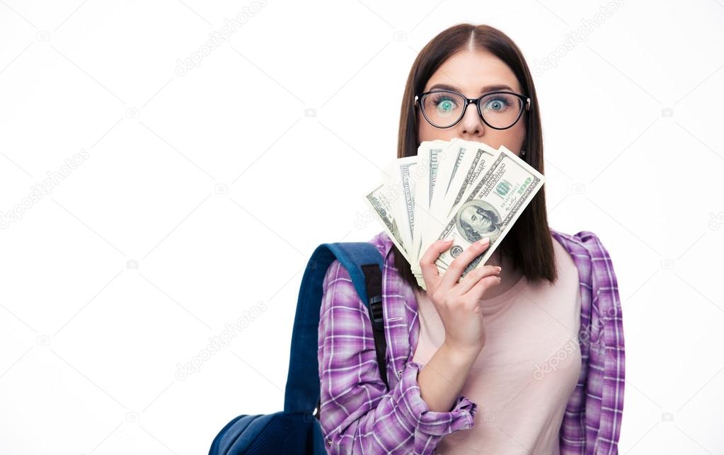 Young woman covering her mouth with bolls of dollar