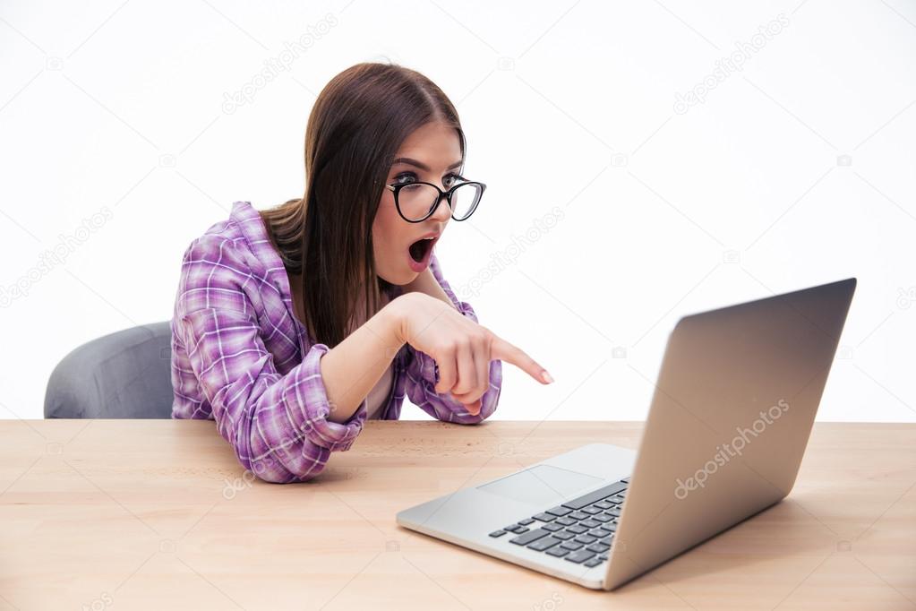 Girl Face Screen A Internet Time Student Press Teen Surprised Female Student In Gl Sitting At The Table With Laptop Over White Background And Showing Finger On Screen Photo By Vadymvdrobot