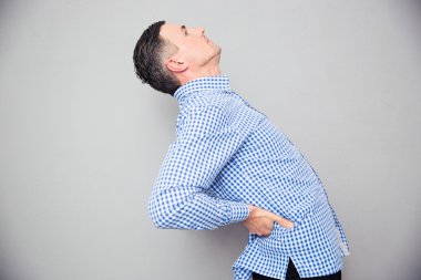 Man having a back pain clipart