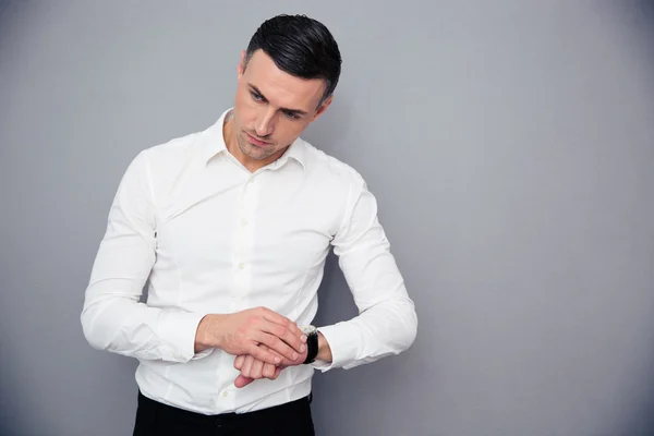 Portrait of a pensive businessman with wristwatch — Stock Photo, Image