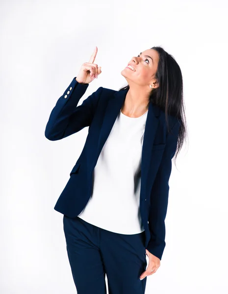 Sorrindo empresária apontando dedo para cima — Fotografia de Stock