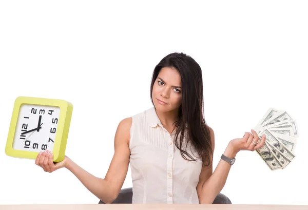 Businesswoman sitting at the table with money and clock — Stock Photo, Image