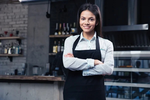 Happy pretty female waiter in apron — Stock Photo, Image