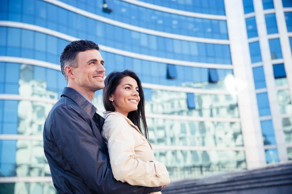 Happy young couple hugging outdoors — Stock Photo, Image