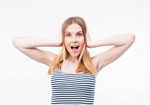 Surprised young woman covering her ears wit hands — Stock Photo, Image