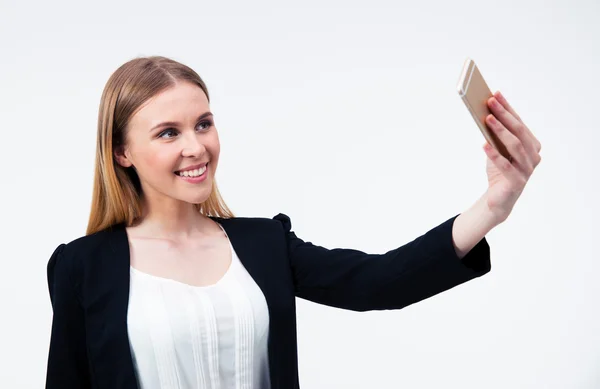 Businesswoman making selfie photo on smartphone — Stock Photo, Image