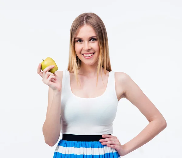 Щаслива молода жінка тримає зелене яблуко — стокове фото