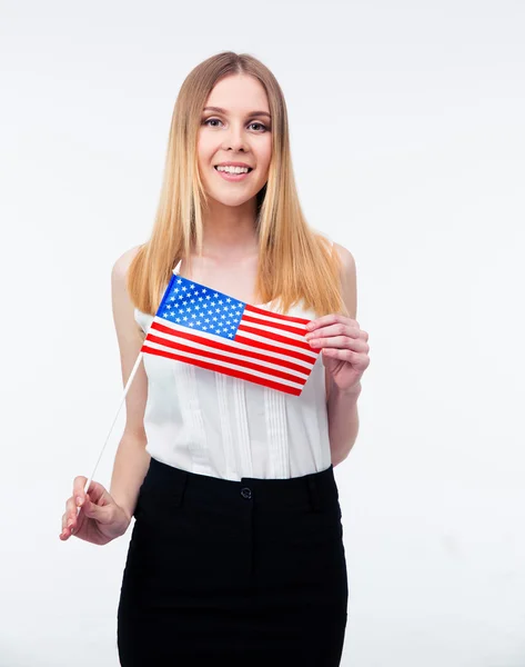 Glimlachend jonge zakenvrouw houdt ons vlag — Stockfoto