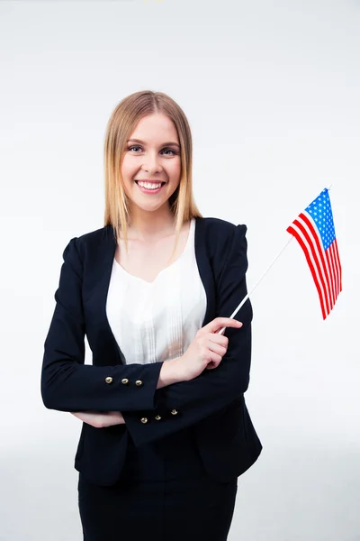 Sorrindo jovem empresária segurando bandeira dos EUA — Fotografia de Stock