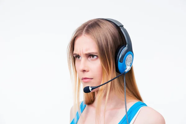 Angry young woman operator in headset — Stock Photo, Image