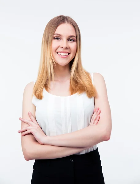 Cheerful businesswoman standing with arms folded — Stock Photo, Image