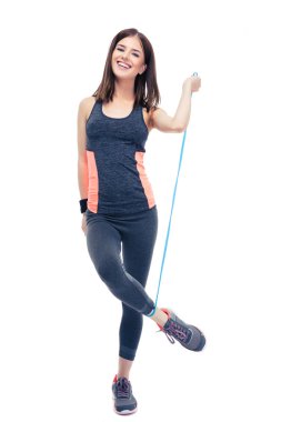 Happy woman standing with jumping rope clipart