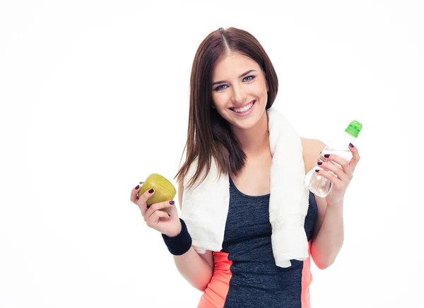 Fitness woman holding apple and bottle with water — Stock Photo, Image