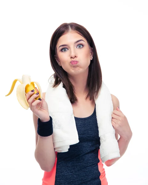 Donna sportiva mangiare banana — Foto Stock