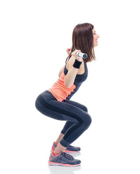 Fitness woman doing squatting with barbell — Stock Photo, Image