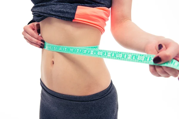 Mulher medindo sua barriga com uma fita métrica , — Fotografia de Stock