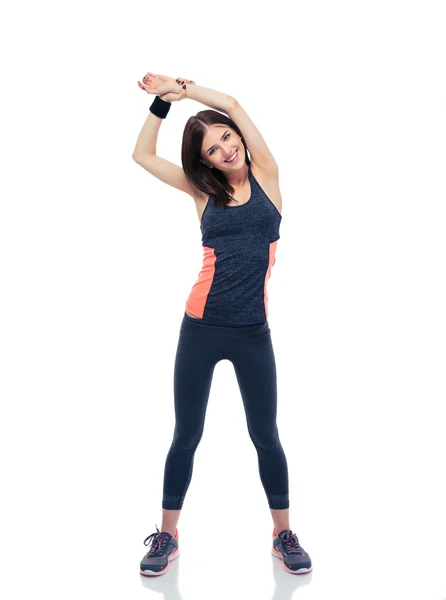 Smiling sporty woman doing stretching exercise — Stock Photo, Image