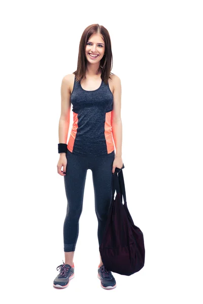 Pretty woman standing with sports bag — Stock Photo, Image