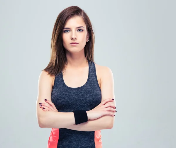 Cute young fitness woman with arms folded — Stock Photo, Image