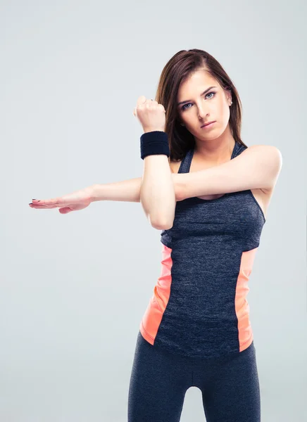 Cute fitness woman stretching hands — Stock Photo, Image