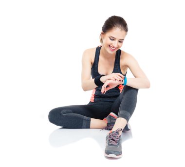 Sporty woman using smart watch clipart