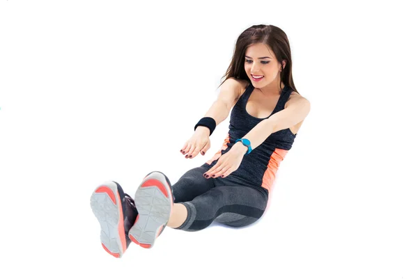 Sporty woman doing abdominal exercises — Stock Photo, Image