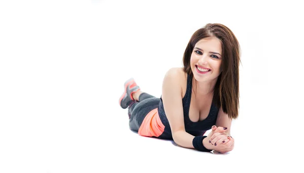 Sporty young woman lying on the floor — Stock Photo, Image