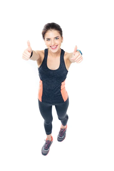 Happy fitness woman showing thumbs up — Stock Photo, Image
