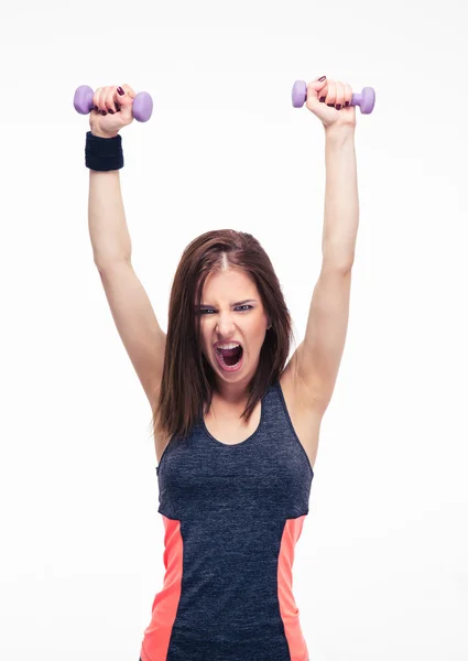 Screaming woman working out with dumbbells — Stock Photo, Image